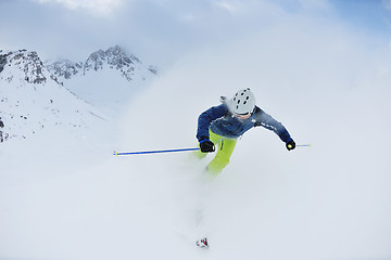 Image showing skiing on fresh snow at winter season at beautiful sunny day