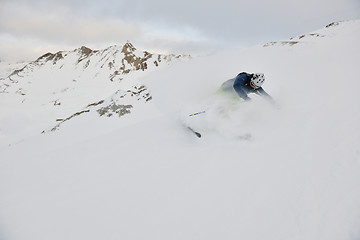 Image showing skiing on fresh snow at winter season at beautiful sunny day