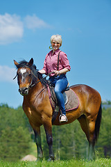 Image showing happy woman  on  horse