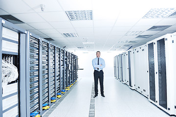 Image showing young it engeneer in datacenter server room