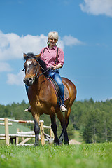 Image showing happy woman  on  horse