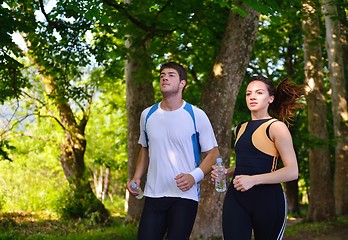 Image showing Young couple jogging