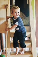 Image showing beautiful young child making first steps