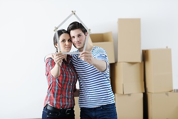 Image showing Young couple moving in new house