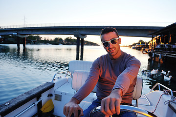 Image showing portrait of happy young man on boat