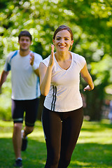 Image showing Young couple jogging