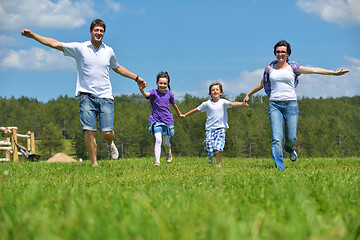 Image showing happy young family have fun outdoors