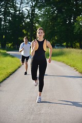 Image showing Young couple jogging