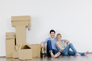 Image showing Young couple moving in new house