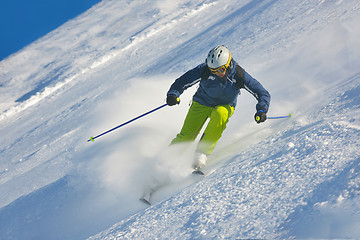 Image showing skiing on fresh snow at winter season at beautiful sunny day