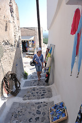 Image showing Greek woman on the streets of Oia, Santorini, Greece