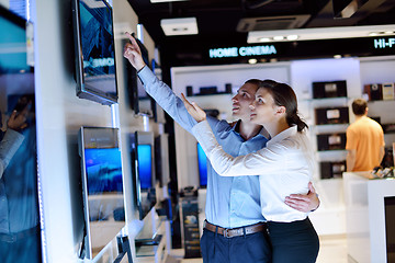 Image showing Young couple in consumer electronics store