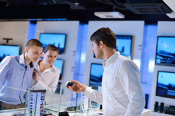 Image showing Young couple in consumer electronics store