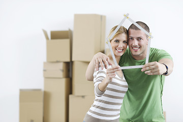 Image showing Young couple moving in new home