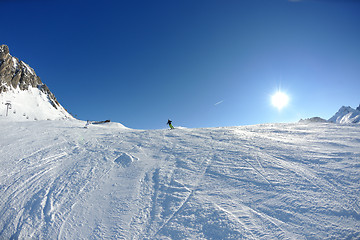 Image showing skiing on fresh snow at winter season at beautiful sunny day