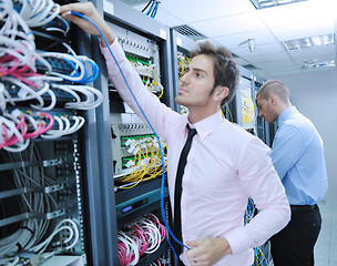 Image showing it enineers in network server room