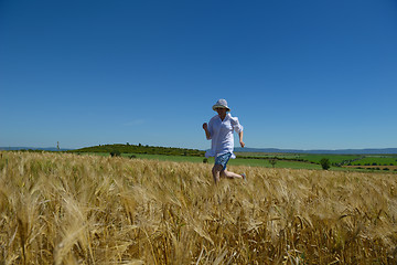 Image showing young woman in wheat field at summer