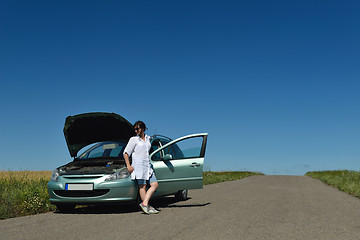 Image showing woman with broken car