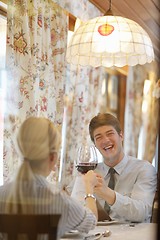 Image showing young couple having dinner at a restaurant