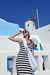 Image showing Greek woman on the streets of Oia, Santorini, Greece