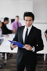 Image showing young business man at meeting