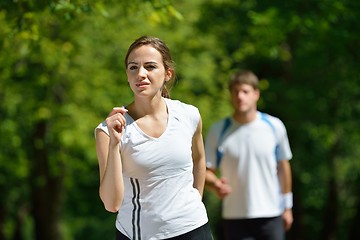 Image showing Young couple jogging at morning