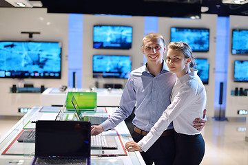 Image showing Young couple in consumer electronics store