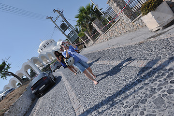 Image showing Greek woman on the streets of Oia, Santorini, Greece