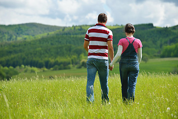 Image showing Portrait of romantic young couple smiling together outdoor