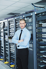 Image showing young it engeneer in datacenter server room