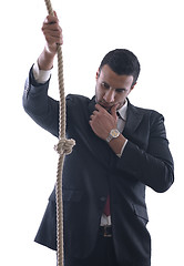 Image showing business man with rope isolated on white background