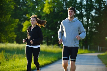 Image showing Young couple jogging