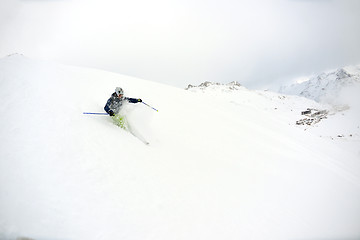 Image showing skiing on fresh snow at winter season at beautiful sunny day