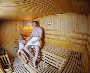 Image showing happy young couple in sauna