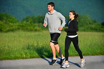 Image showing Young couple jogging