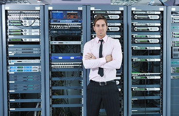 Image showing young it engeneer in datacenter server room