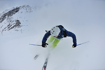 Image showing skiing on fresh snow at winter season at beautiful sunny day