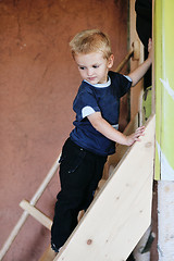 Image showing beautiful young child making first steps