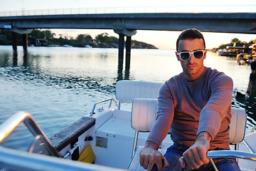 Image showing portrait of happy young man on boat