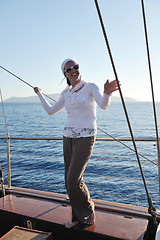 Image showing Greek woman on the streets of Oia, Santorini, Greece