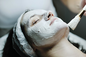 Image showing woman with facial mask in cosmetic studio