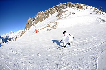 Image showing skiing on fresh snow at winter season at beautiful sunny day