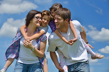 Image showing happy young family have fun outdoors