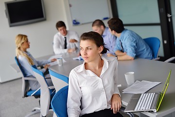 Image showing business woman with her staff in background at office