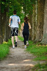 Image showing Young couple jogging