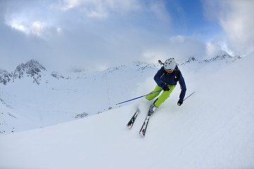 Image showing skiing on fresh snow at winter season at beautiful sunny day