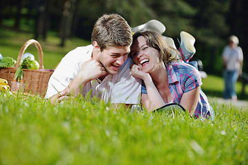 Image showing happy young couple having a picnic outdoor