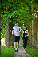 Image showing Young couple jogging