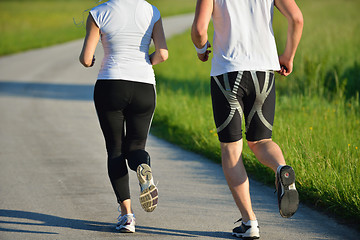 Image showing Young couple jogging at morning