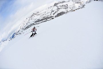 Image showing skiing on fresh snow at winter season at beautiful sunny day